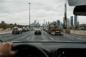 Busy highway with city skyline ahead